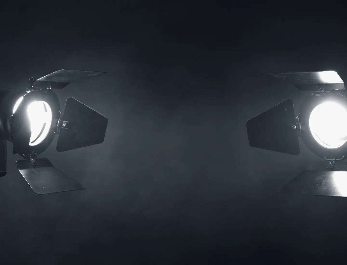 Two movie reflectors aiming into the center of the scene