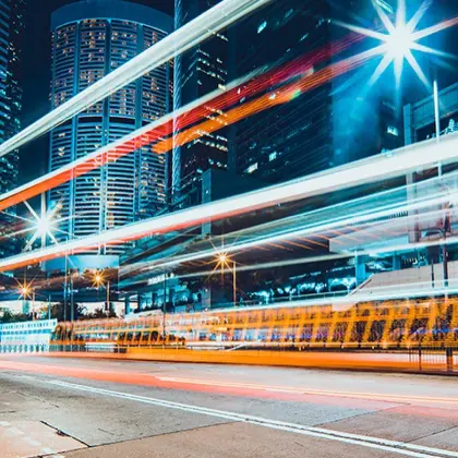 Man in bar smiling while holding beer