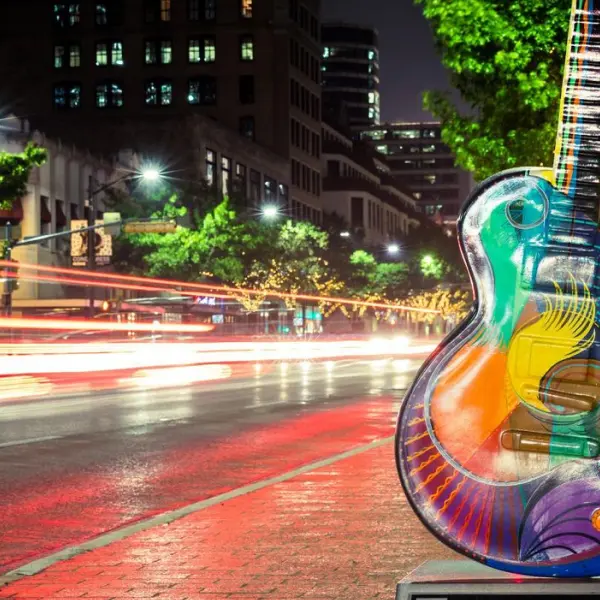 Actor sitting on iceberg with illustration figure on right
